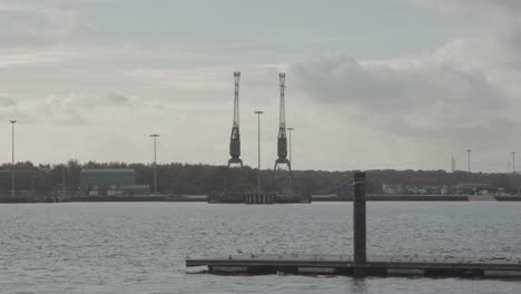 cranes in port in evening sun - ungraded
