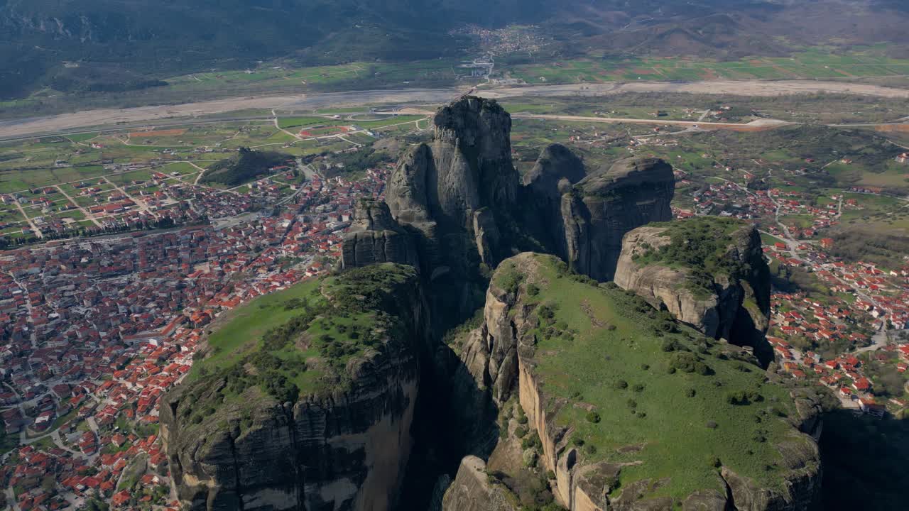 Wide drone angle of Meteora rock formations and isolated monastery near Kalambaka, Greece