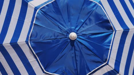 blue striped beach umbrella