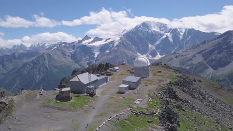 mountain observatory with snowy peaks