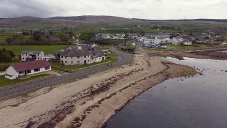 Aerial-view-of-the-Scottish-town-of-Blackwaterfoot-on-the-Isle-of-Arran-on-an-overcast-day,-Scotland