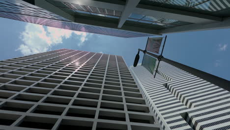 giant corporate office buildings display cityscape grandeur from low angle