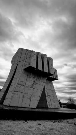 abstract concrete fist monument in black and white