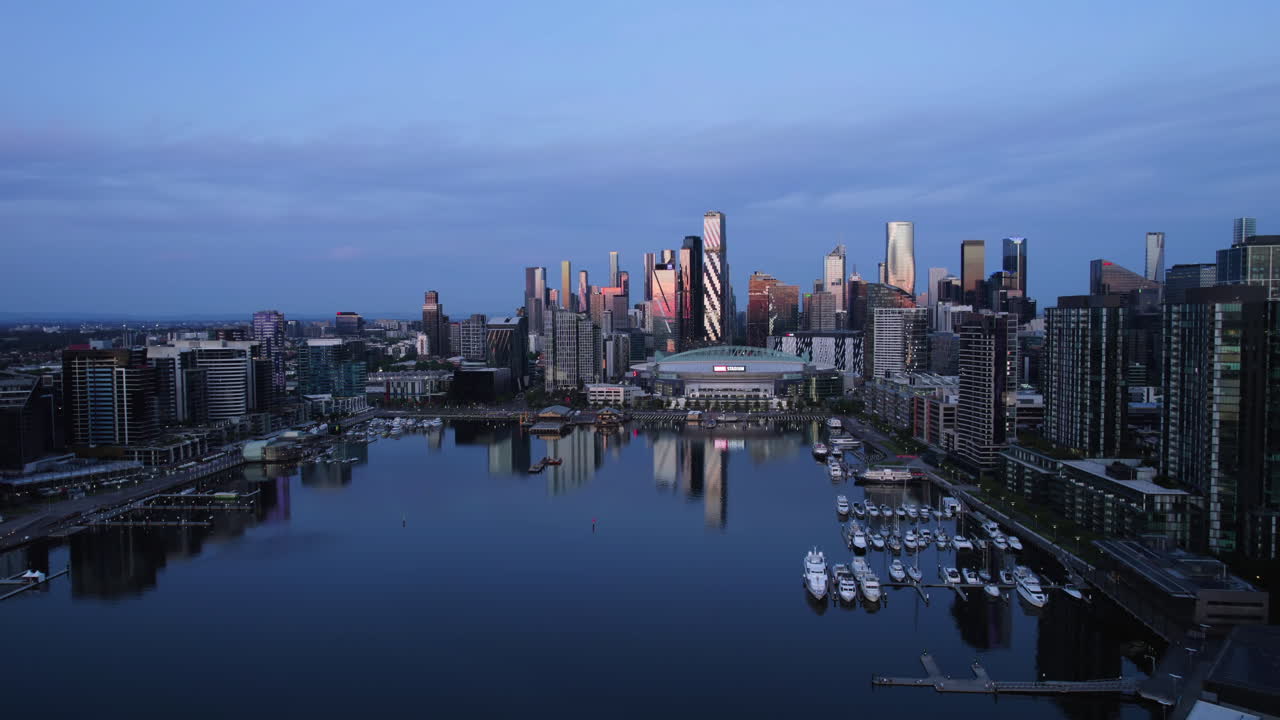 Aerial ascending shot of a quiet, serene sunrise in the Docklands of Melbourne