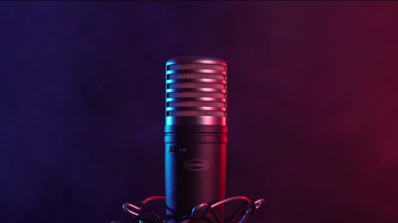 Adjusting Professional Studio Microphone in Smoky Neon Light