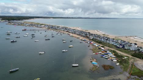 pull back drone aerial reverse reveal beach huts mudeford sandbank christchurch uk