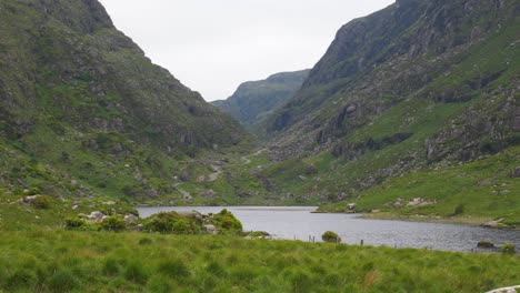 black lake at the head of the gap of dunloe in county kerry, ireland