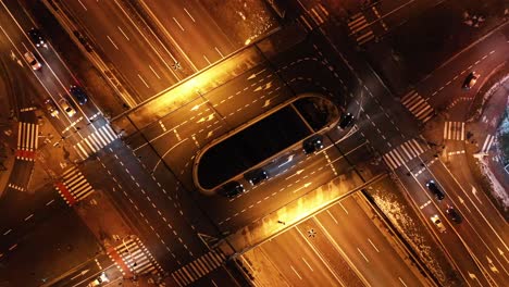 Aerial-view-of-the-road-intersection-on-the-DTŚ-Highway-in-Katowice---Day-to-night-transition