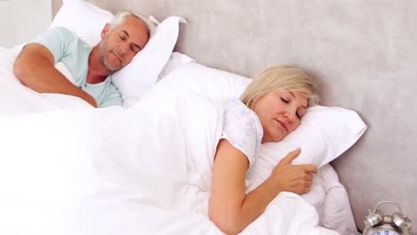 Peaceful-couple-sleeping-in-bed