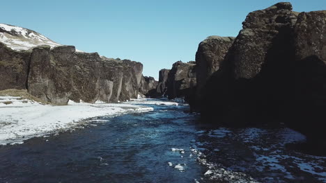 Aerial-View-Drone-Flying-in-beautiful-scenery-between-mountains-in-cold-Iceland