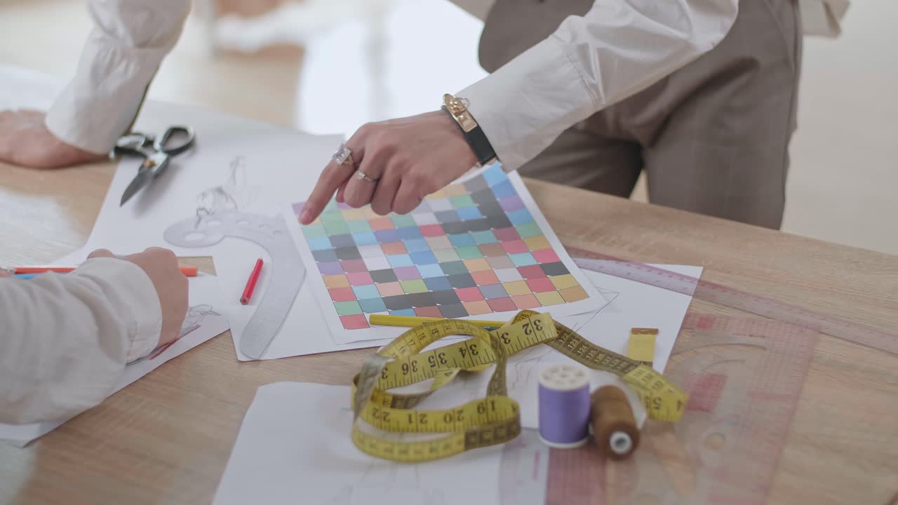 Close Up Two Fashion Designers Sketching At Fashion Design Studio