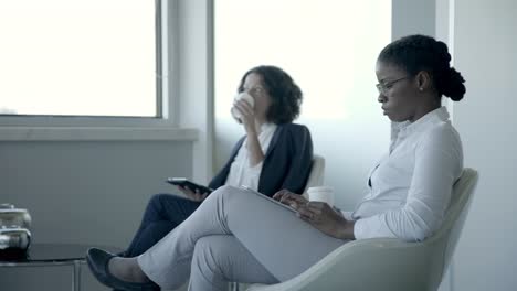 multiethnic women using digital tablets