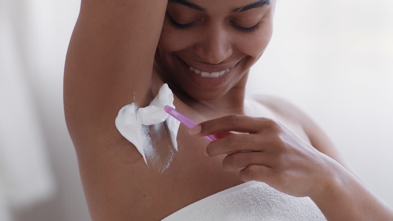 Woman Shaving Her Underarm
