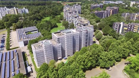 large grey towers emerge from the forest in the german city of ulm