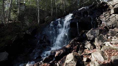 small waterfall in the forest at saint-come, quebec, canada