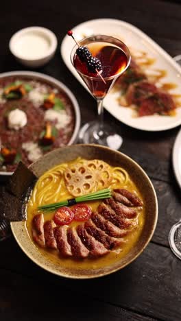 fine dining experience with duck ramen and cocktails