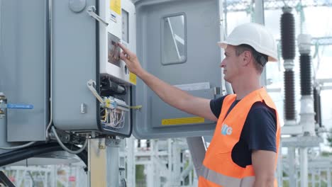 electrical engineers inspect the electrical systems at the equipment control cabinet