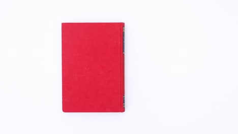 livro vermelho mudando páginas. parar de movimento
