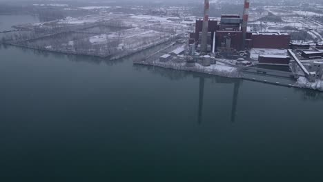 massive facilities of coal power plant on bank of detroit river, aerial view