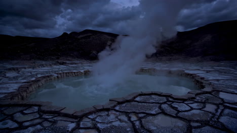 steaming hot spring at dusk