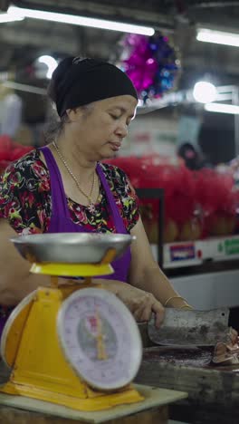 a woman working at a market