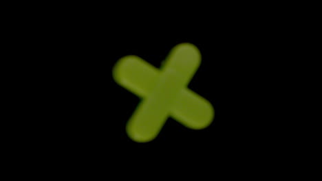 The-letter-x-coming-into-focus-on-black-background