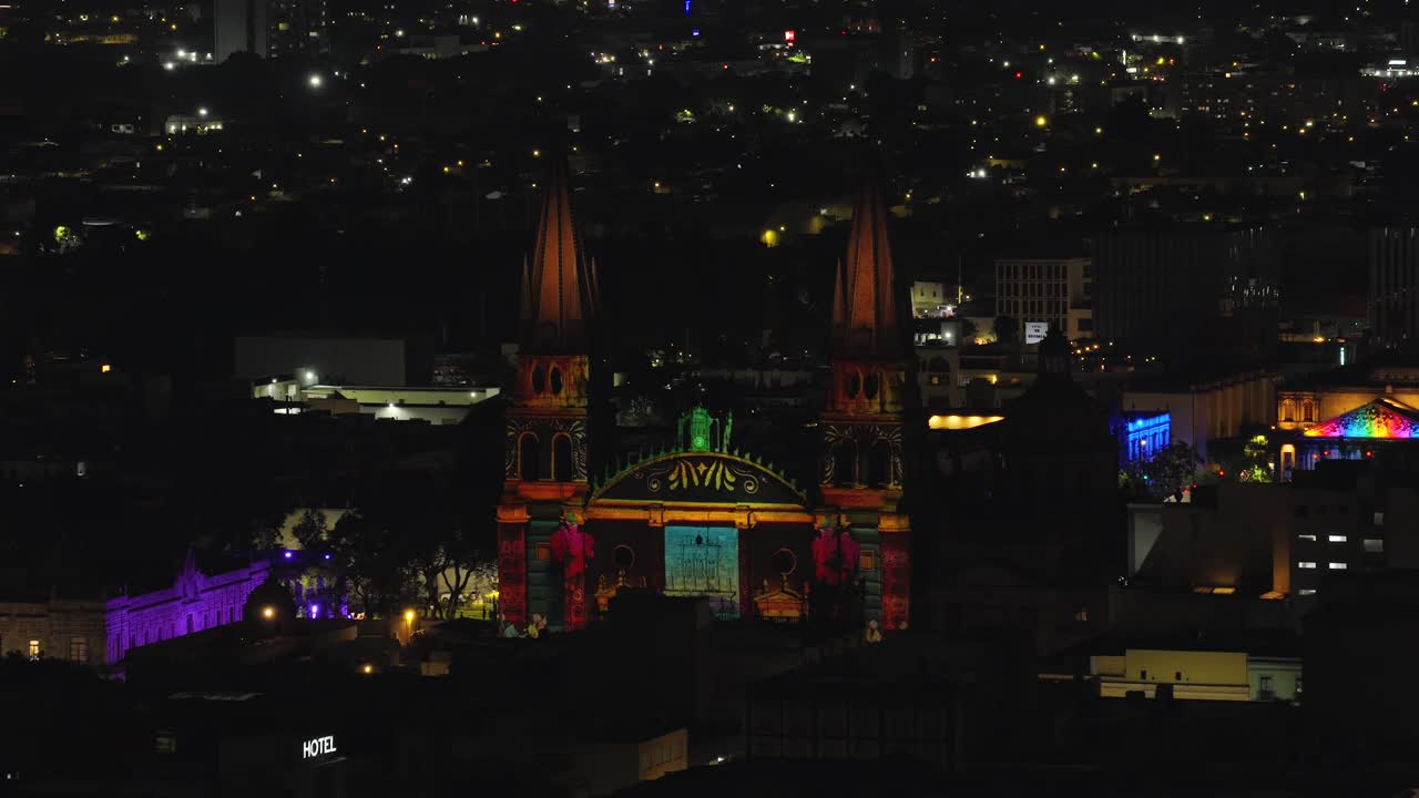 Images and lights projected onto Guadalajara Cathedral at night. Aerial view