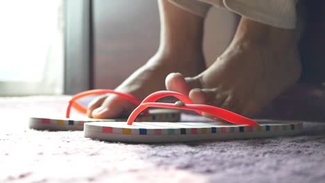 woman wearing flip-flops on a carpet