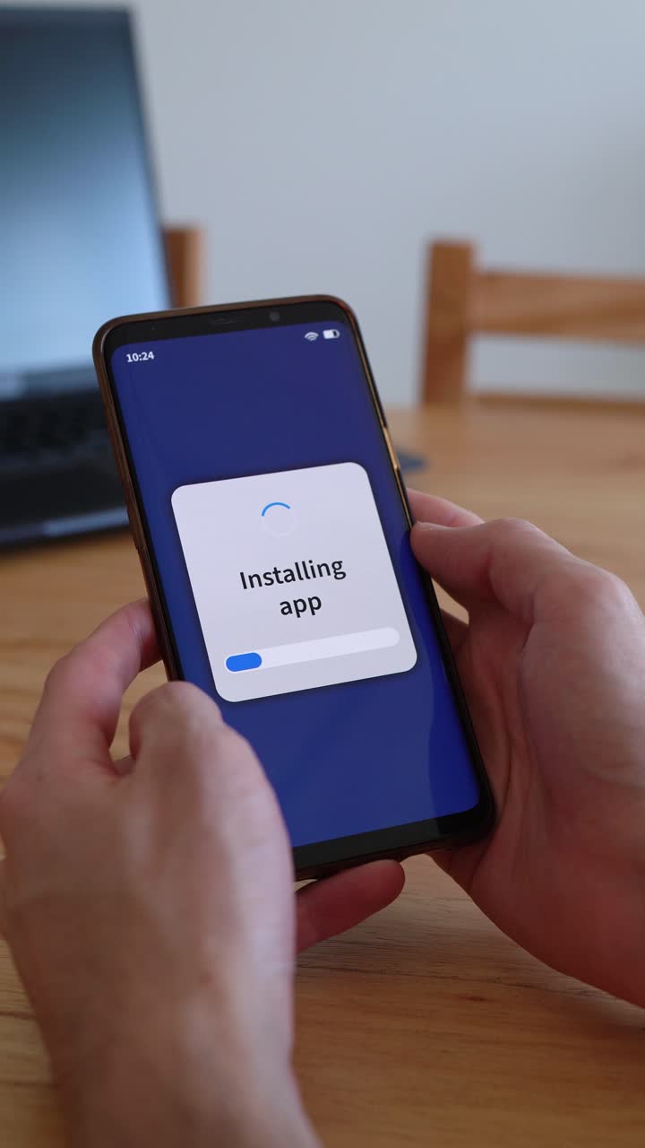 Vertical shot of phone installing new apps