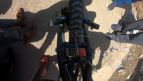 Gopro-top-view-for-Ethiopian-cyclist-reaching-the-end-braking-and-stopping-puddling