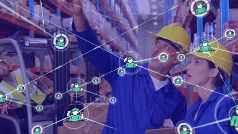 Network-of-profile-icons-against-caucasian-male-and-female-workers-checking-stock-at-warehouse