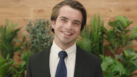 attractive young business man portrait of sales person wearing suit smiling happy enjoying successful lifestyle