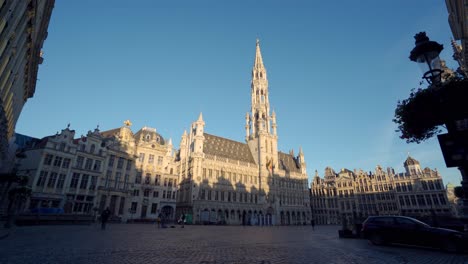 grand place brussels, belgium, wide dolly truck shot sideways with town hall in the center