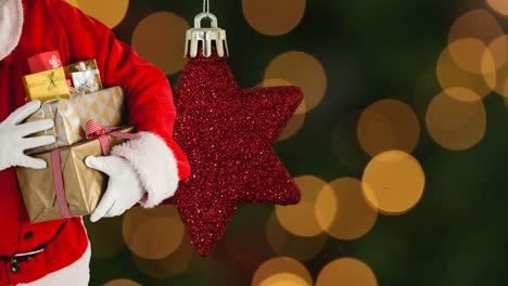 Animación-De-Papá-Noel-Sosteniendo-Regalos-De-Navidad-Sobre-Una-Estrella-Roja-Y-Puntos-De-Luz-Naranja.