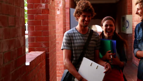 Students-walking-along-the-hallway-chatting