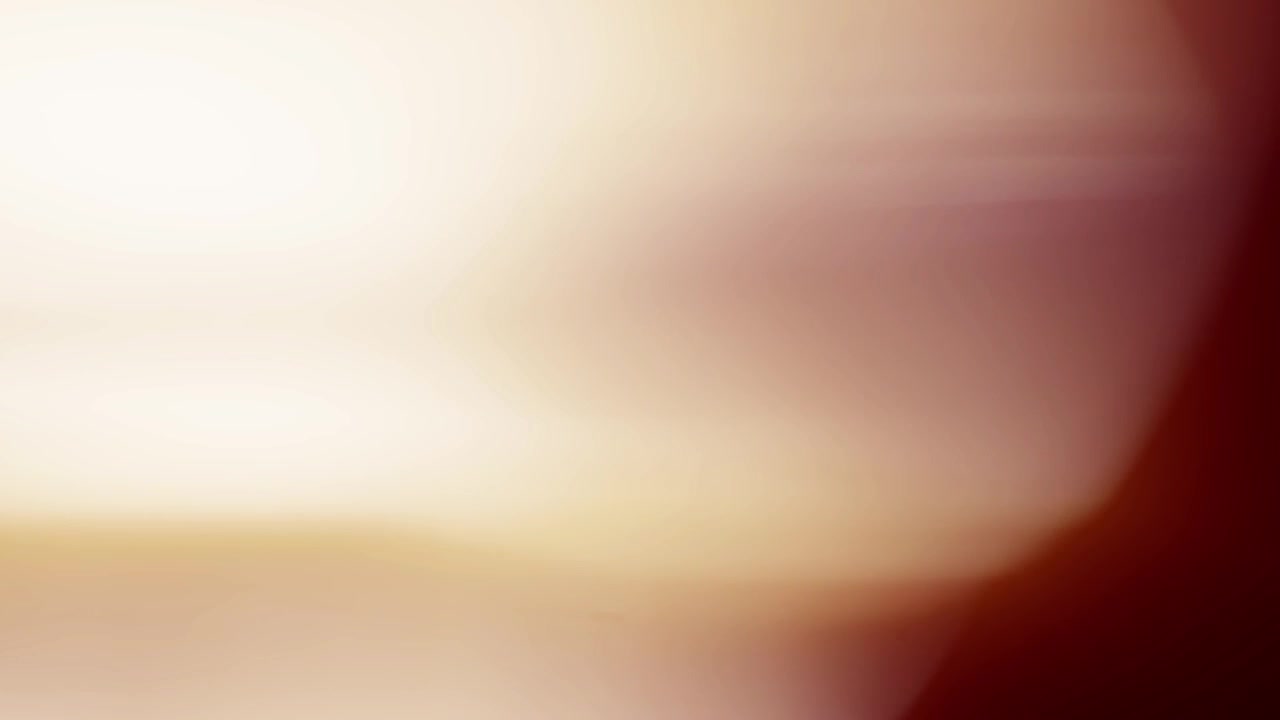 Dynamic Warm Light Leaks and Lens Flares Transitioning on Dark Background
