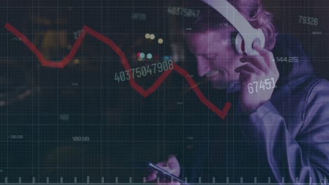 Animation-of-graph-and-changing-numbers,-caucasian-man-using-cellphone-and-listening-to-music