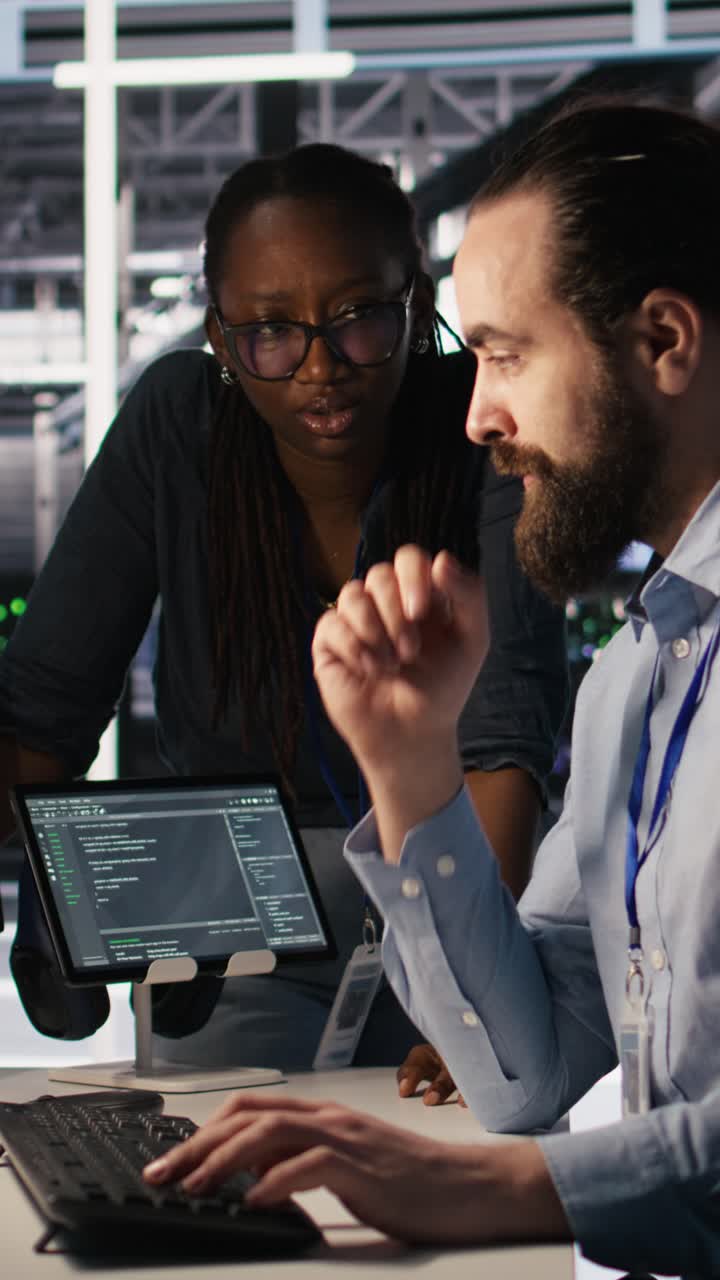 Vertical video Teamworking system administrators in data center using AI automation