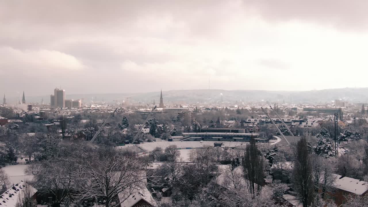 Mysterious City covered in snow, European city covered with snow. Industrial city covered with snow aerial shot. winter city