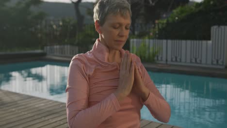 Senior-woman-outdoor-yoga-fitness