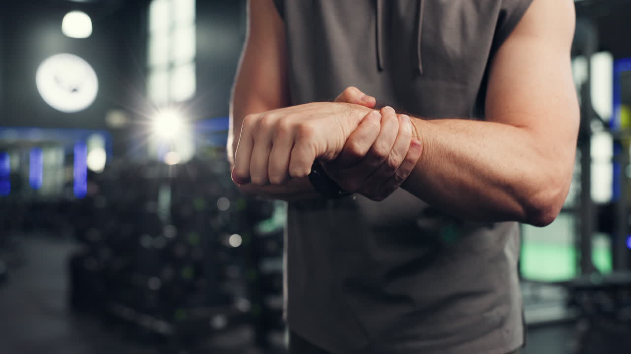 Man checking his wrist at the gym