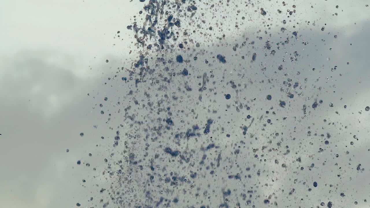 Water droplets. Streams of fountain close-up. Slow motion