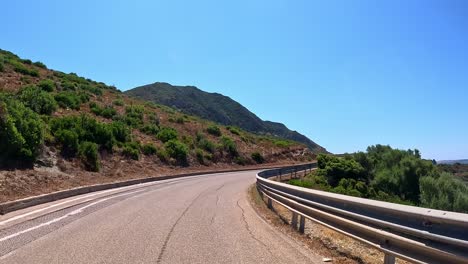 Asphalt-curving-ahead,-round-every-corner-awaits-new-journey,-point-of-view