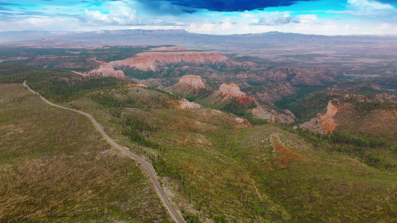 Azure cloudy skies over the mountainous landscape of Utah canyons. Beautiful rocks of Zion National park from top view.
