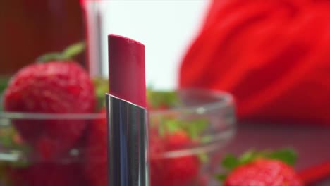 reverse red lipstick melt and precise swipe stroke application on lips, close-up