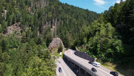 aerial view of traffic on an impressive curve in the mountains