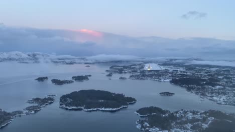 approaching to a norwegian airport in the winter during sunrise