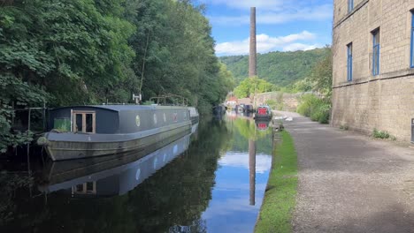 Canal-Boats,-Barges,-long,-narrow-boats-on-a-scenic-stretch-of-canal-in-Yorkshire,-England-1