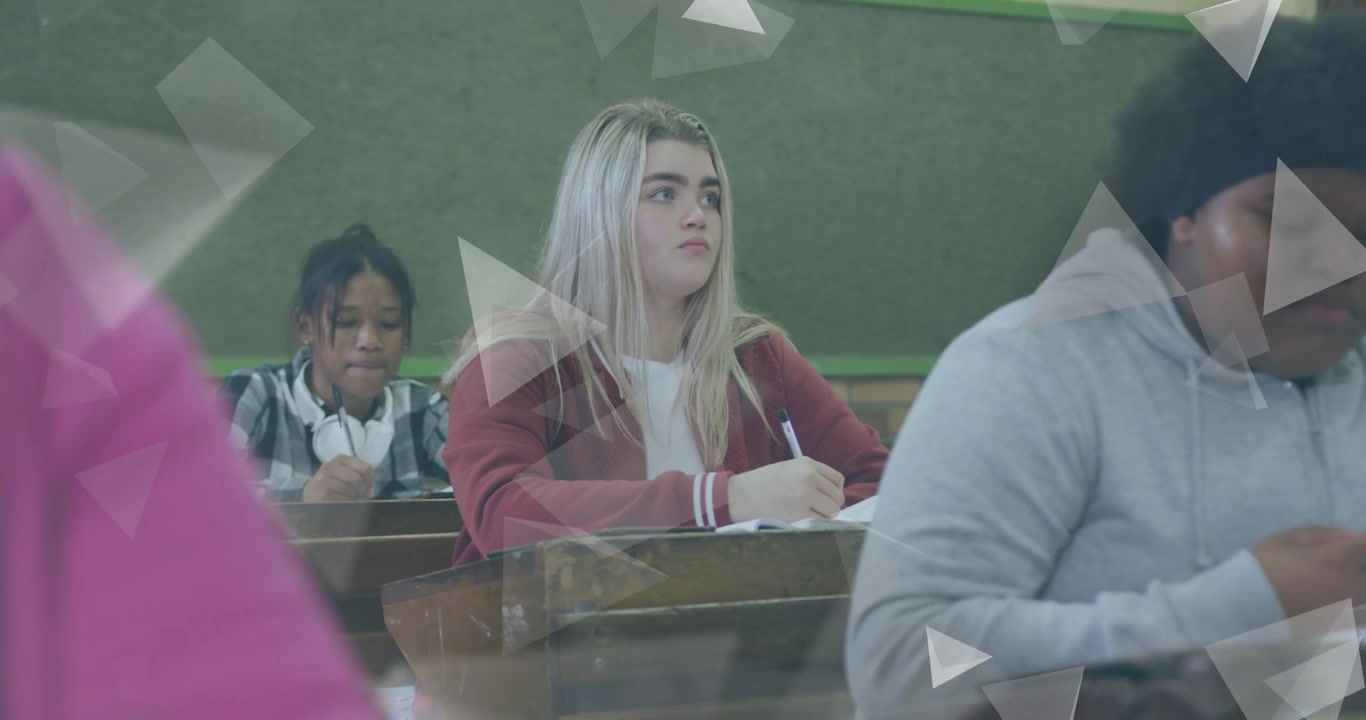 Start sequence teen girl taking notes in class, triangles drifting across frame partly hiding
