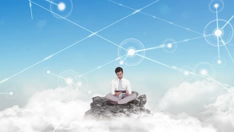 businessman using tablet in the clouds